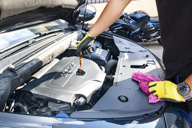 Photo of a technicial checking oil levels