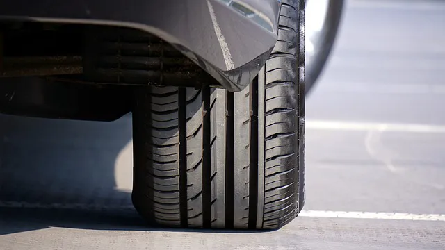 Close up image of a car tire from the rear of the car